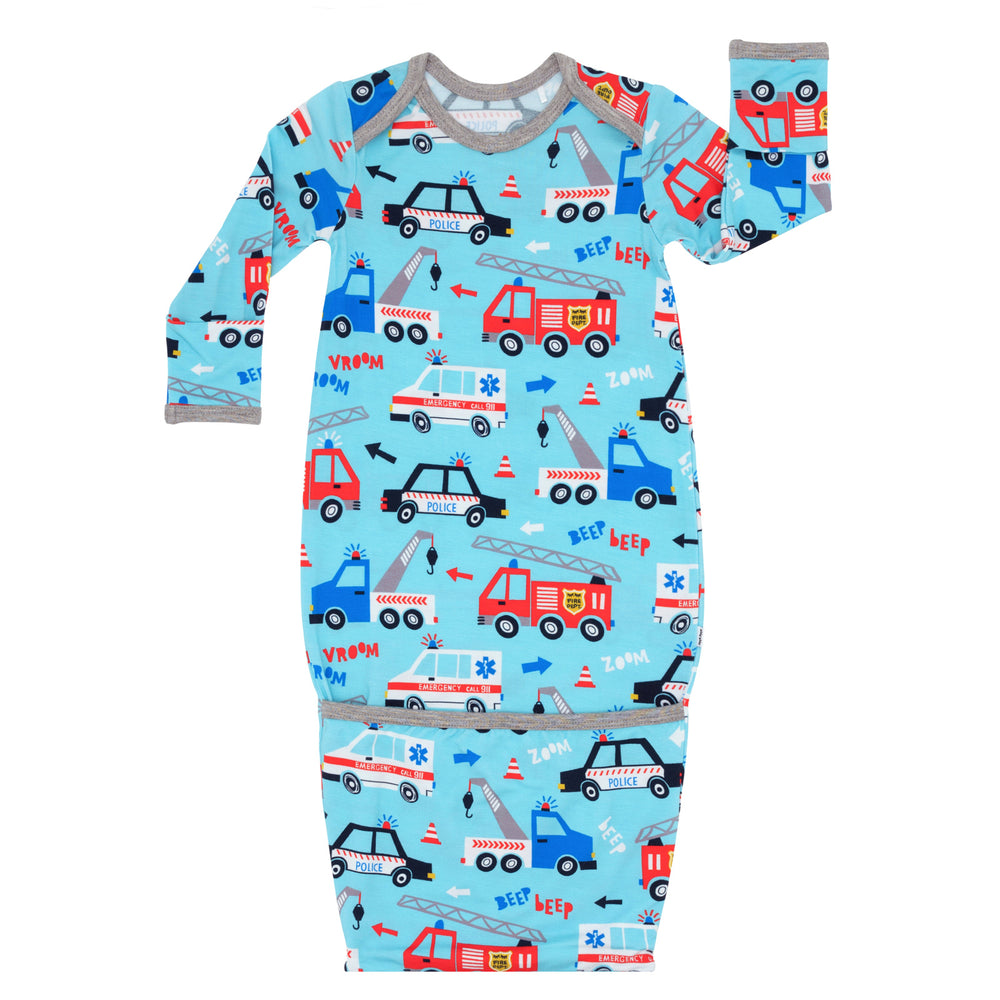 Flat lay image of a To The Rescue infant gown
