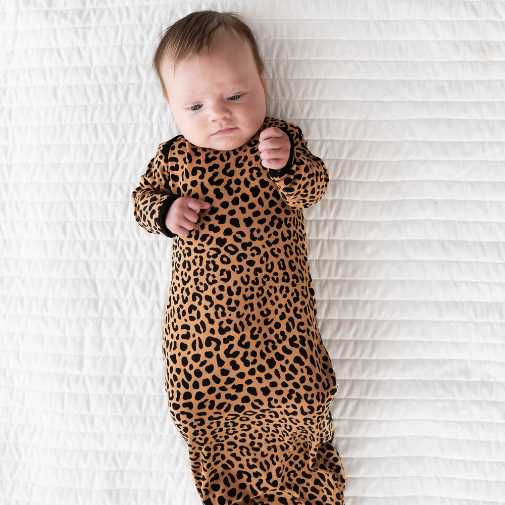 Alternative top view image of baby laying while in the Classic Leopard Infant Gown