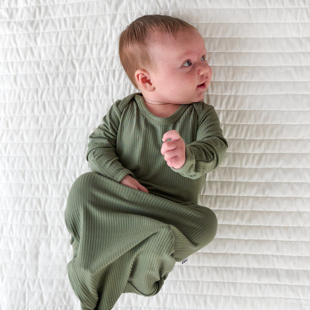 Alternative top view image of baby laying down wearing the Moss Ribbed Infant Gown