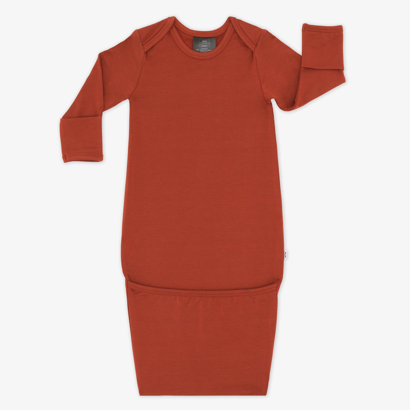 Flat lay image of a Cozy Rust infant gown