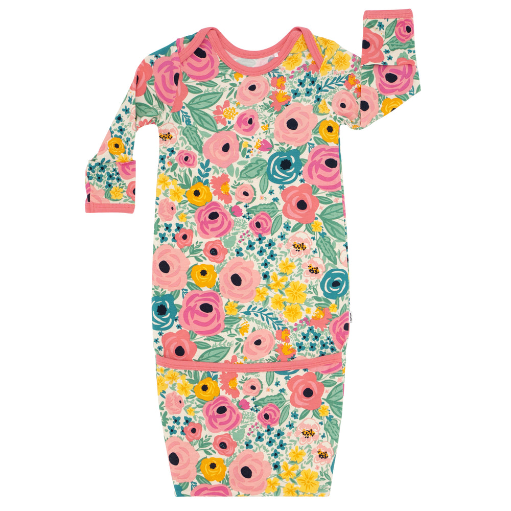 Flat lay image of a Secret Garden infant gown