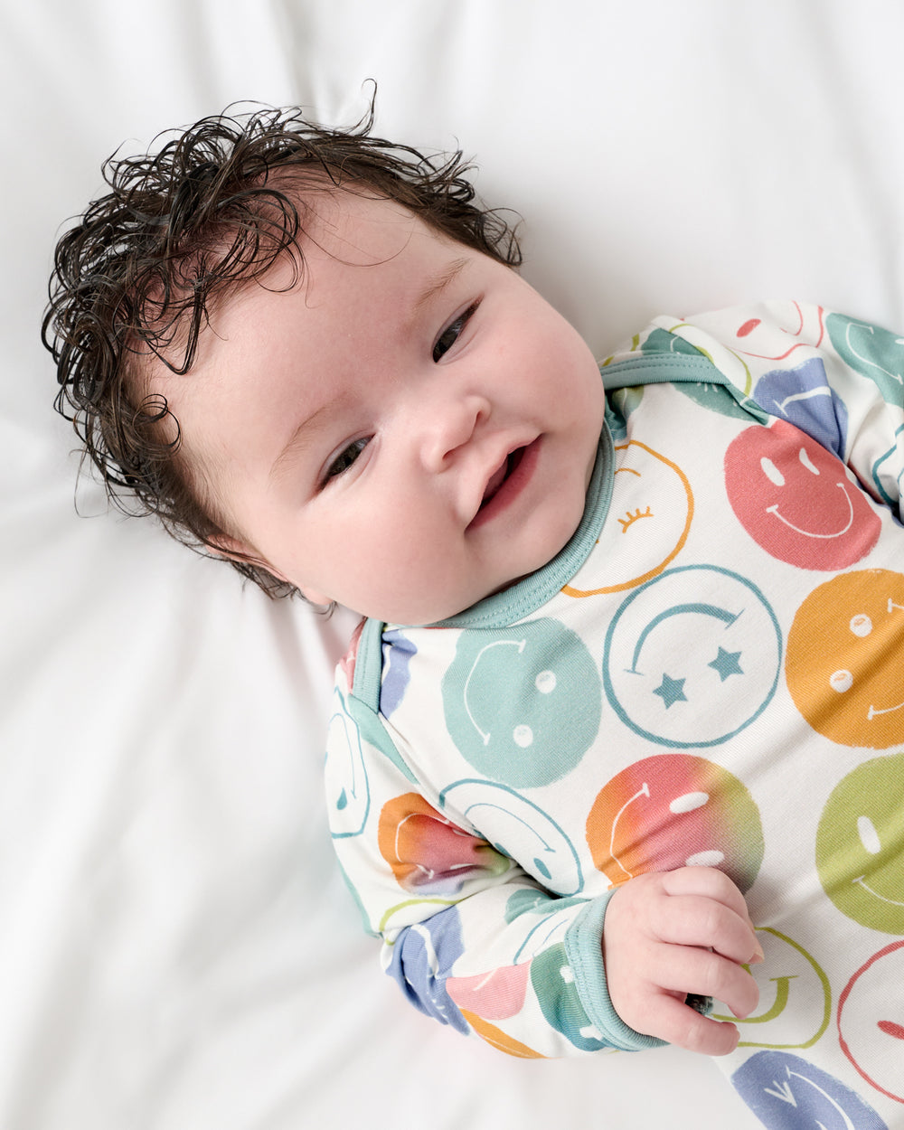 Close up of baby wearing the Positive Vibes Infant Gown