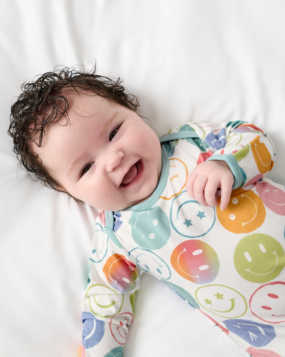 Close up of newborn in the Positive Vibes Infant Gown