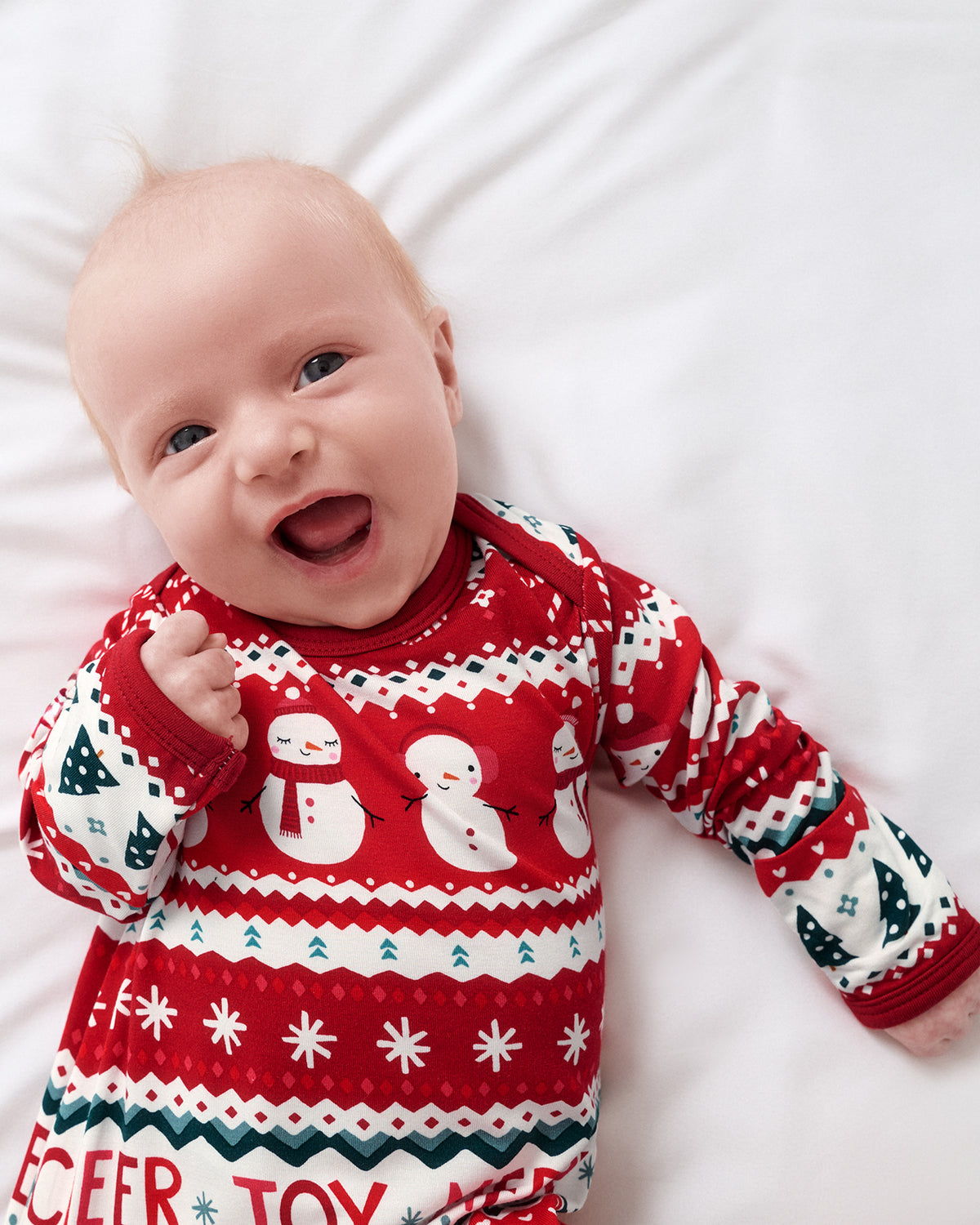 Close up of newborn wearing the Festive Fair Isle Infant Gown