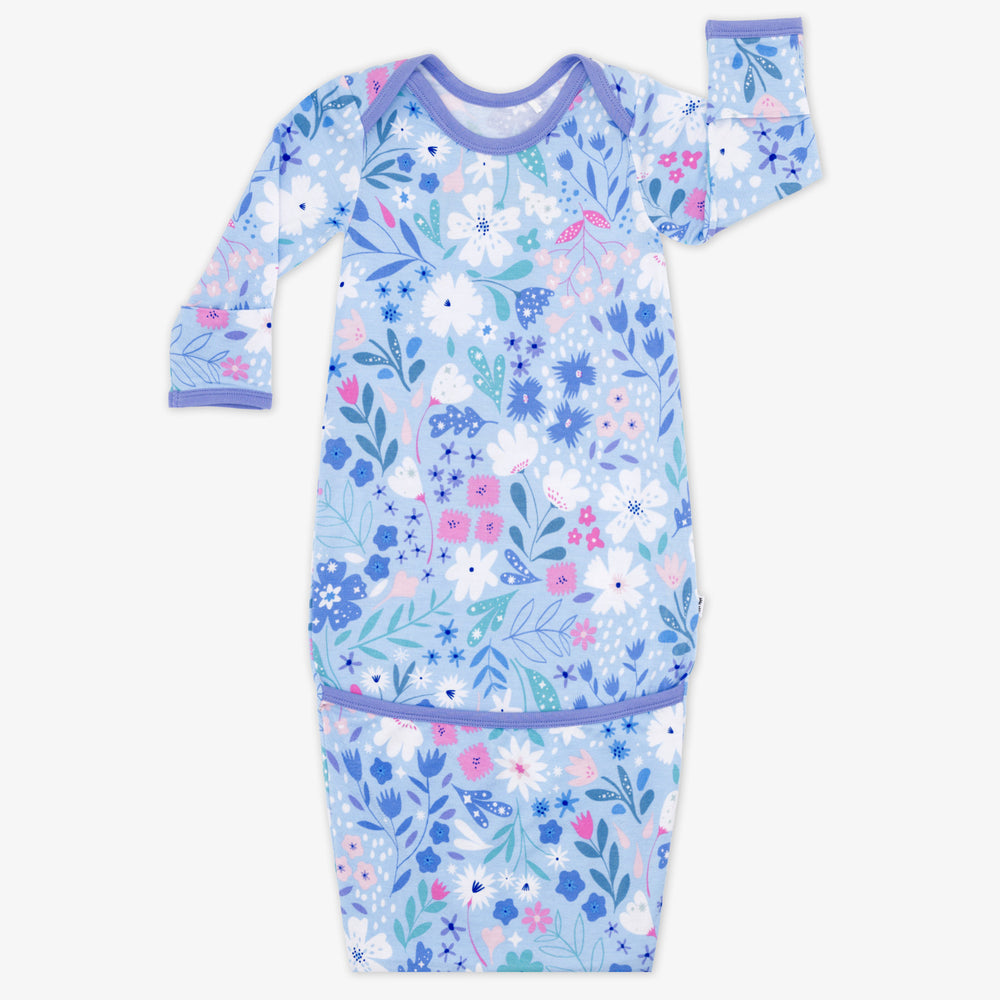 Flat lay image of a Magical Meadow infant gown