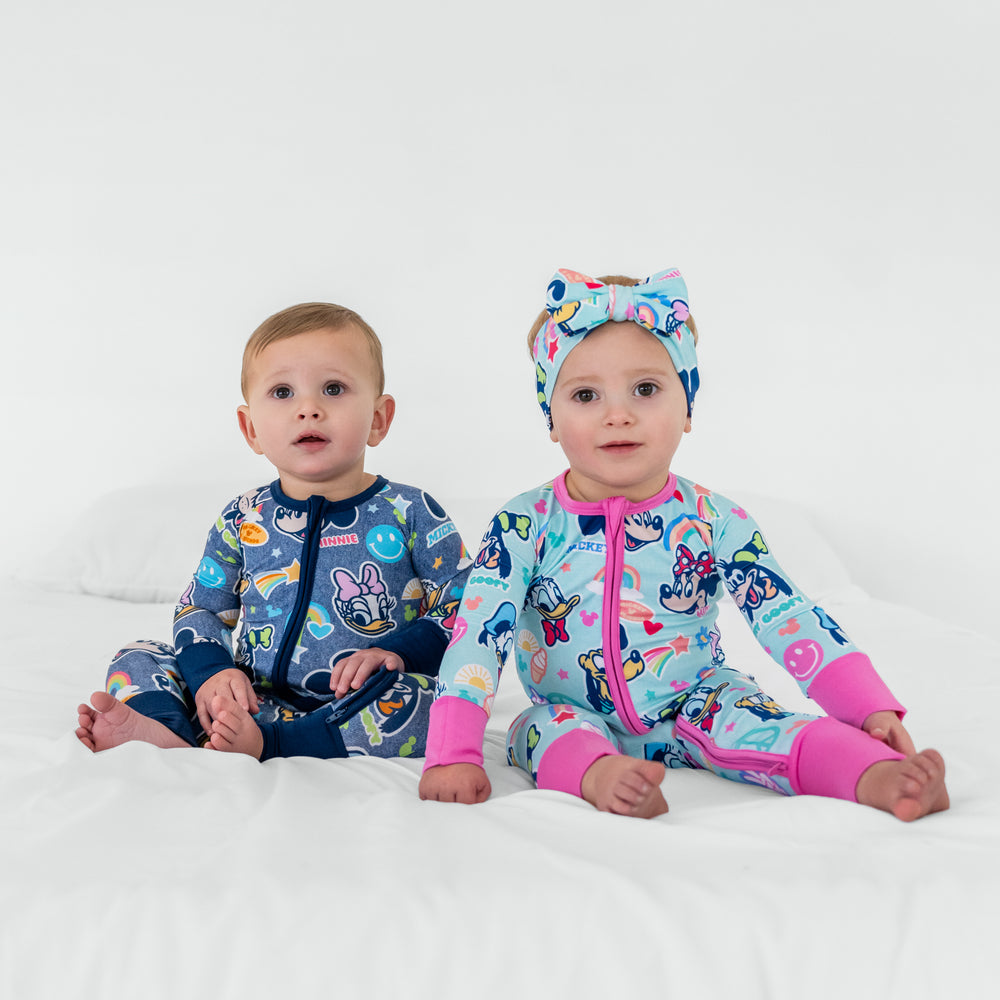 Two children sitting wearing matching  Disney Mickey's Clubhouse bamboo pajamas