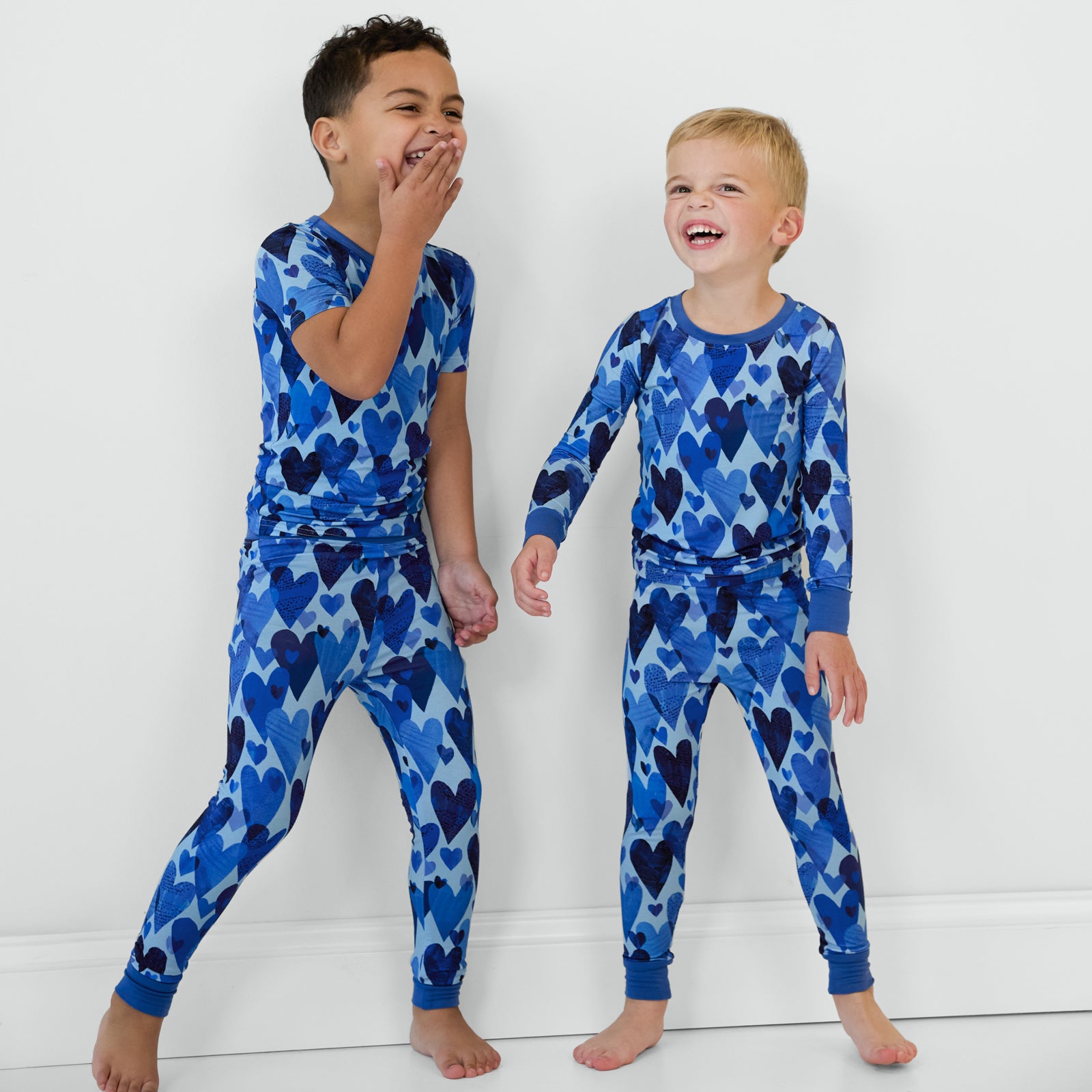 Sibling matching in Blue Hearts & Crafts pajama sets.