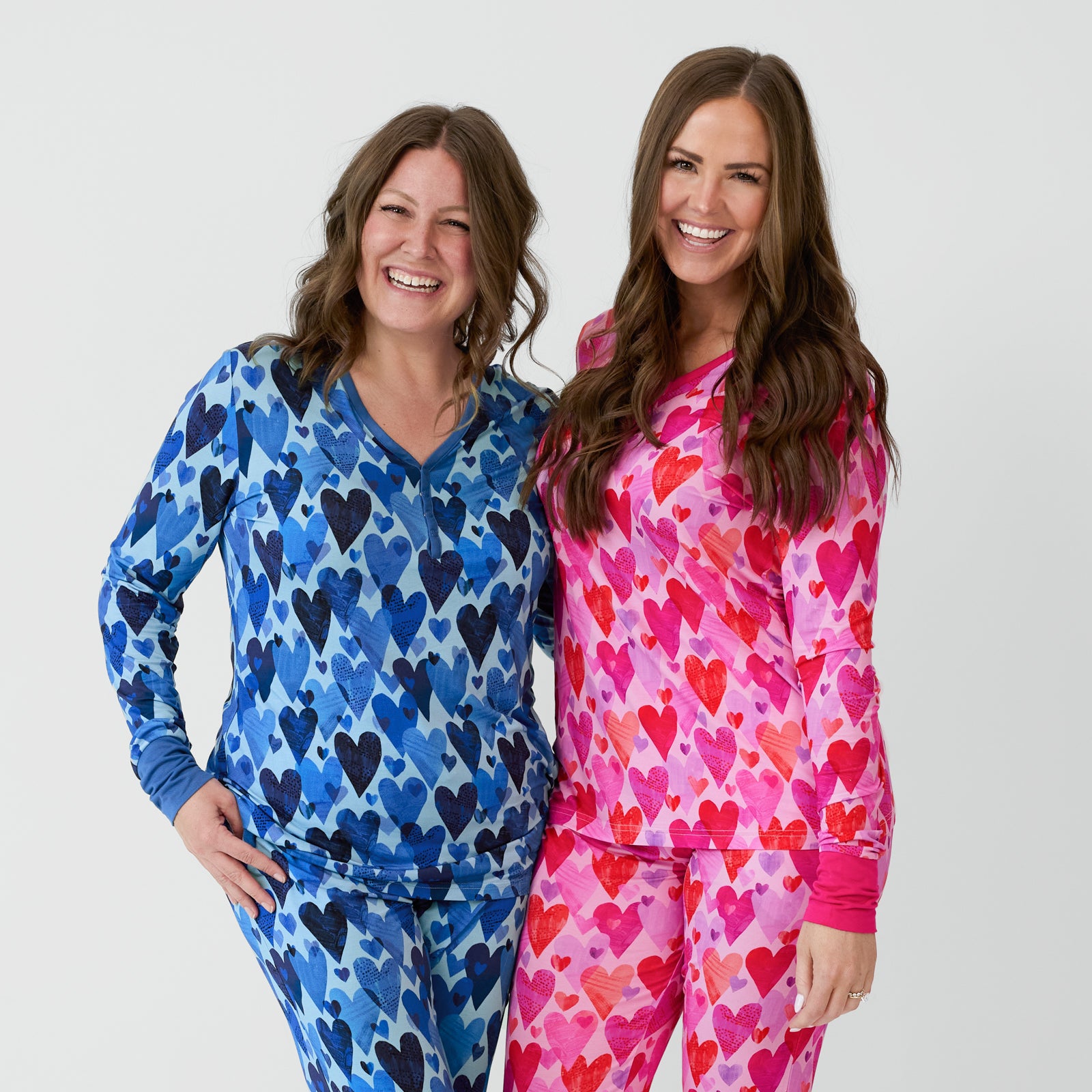 Two women wearing Hearts & Crafts coordinating pajamas.