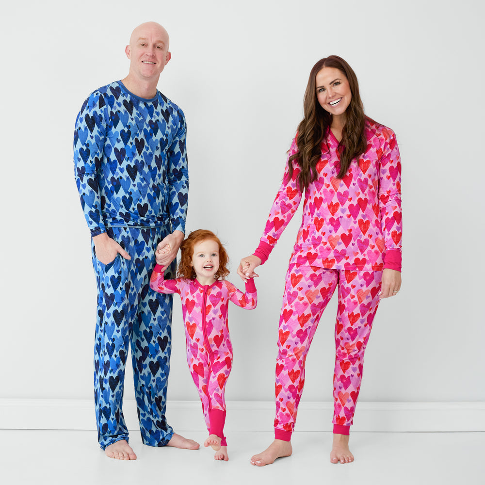 Family matching in coordinating Blue and Pink Hearts & Crafts pajamas.