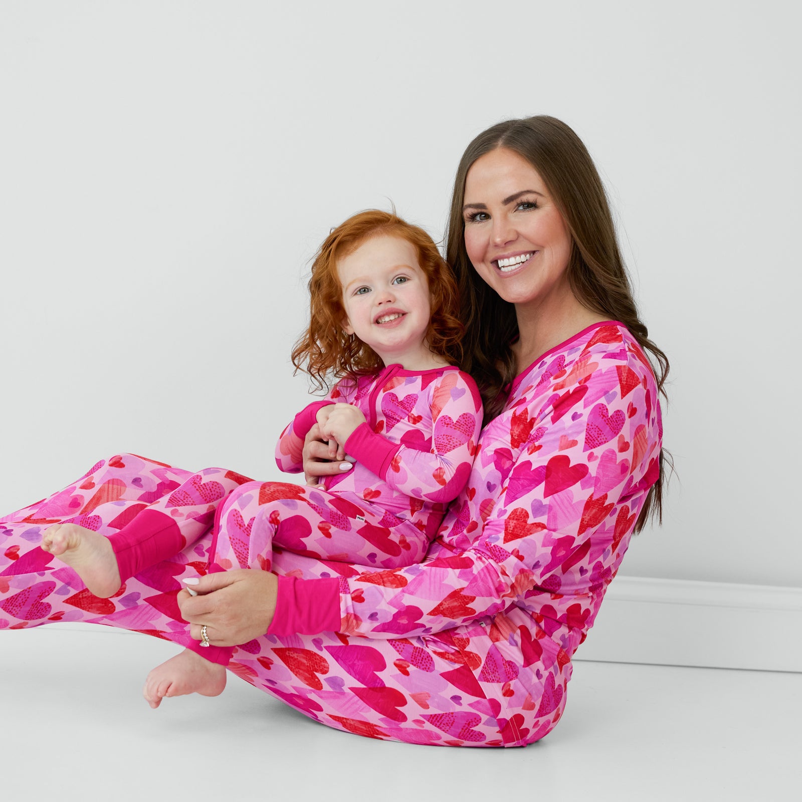 Mommy and me matching in Pink Hearts & Crafts pajamas.