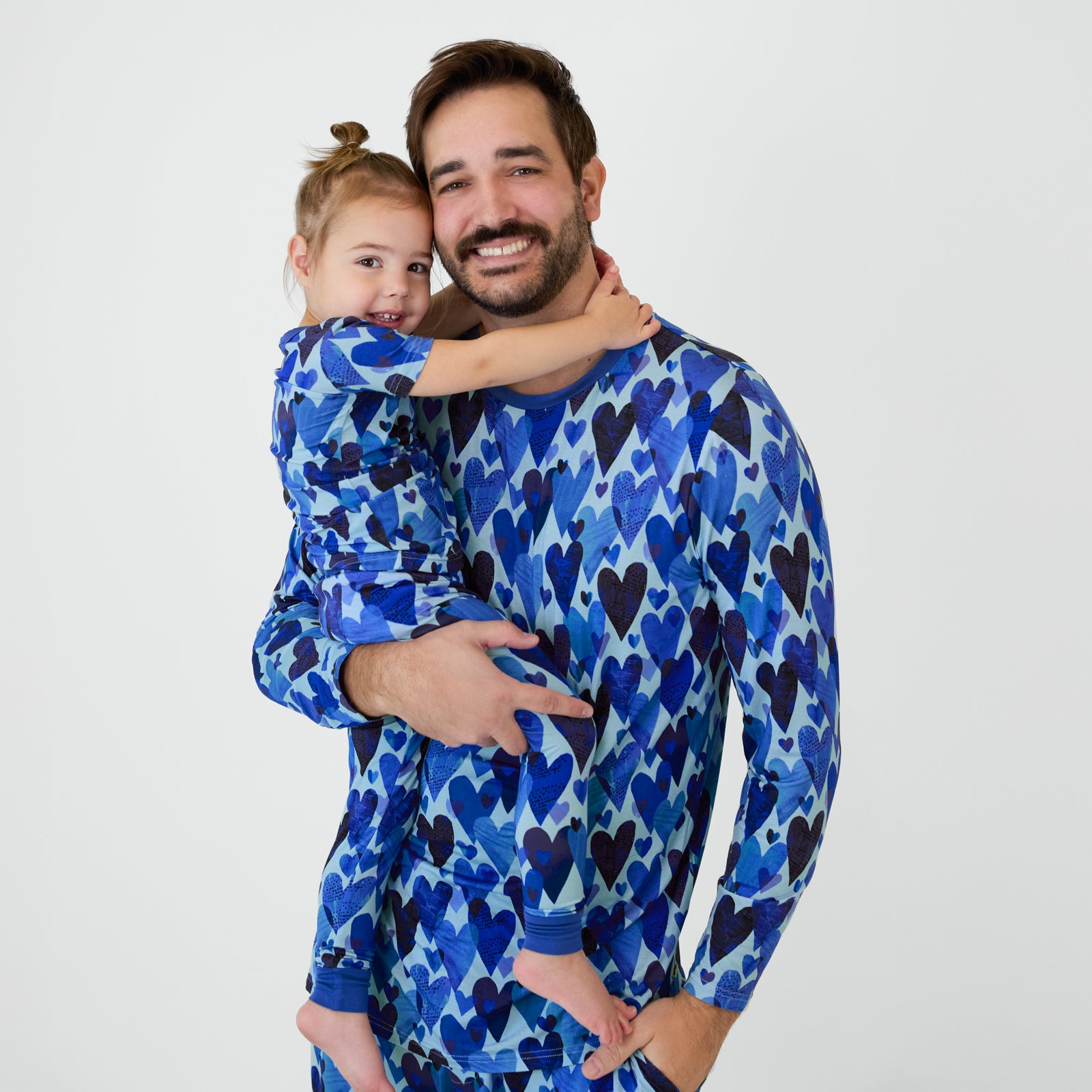 Daddy and me matching in Blue Hearts & Crafts pajamas.