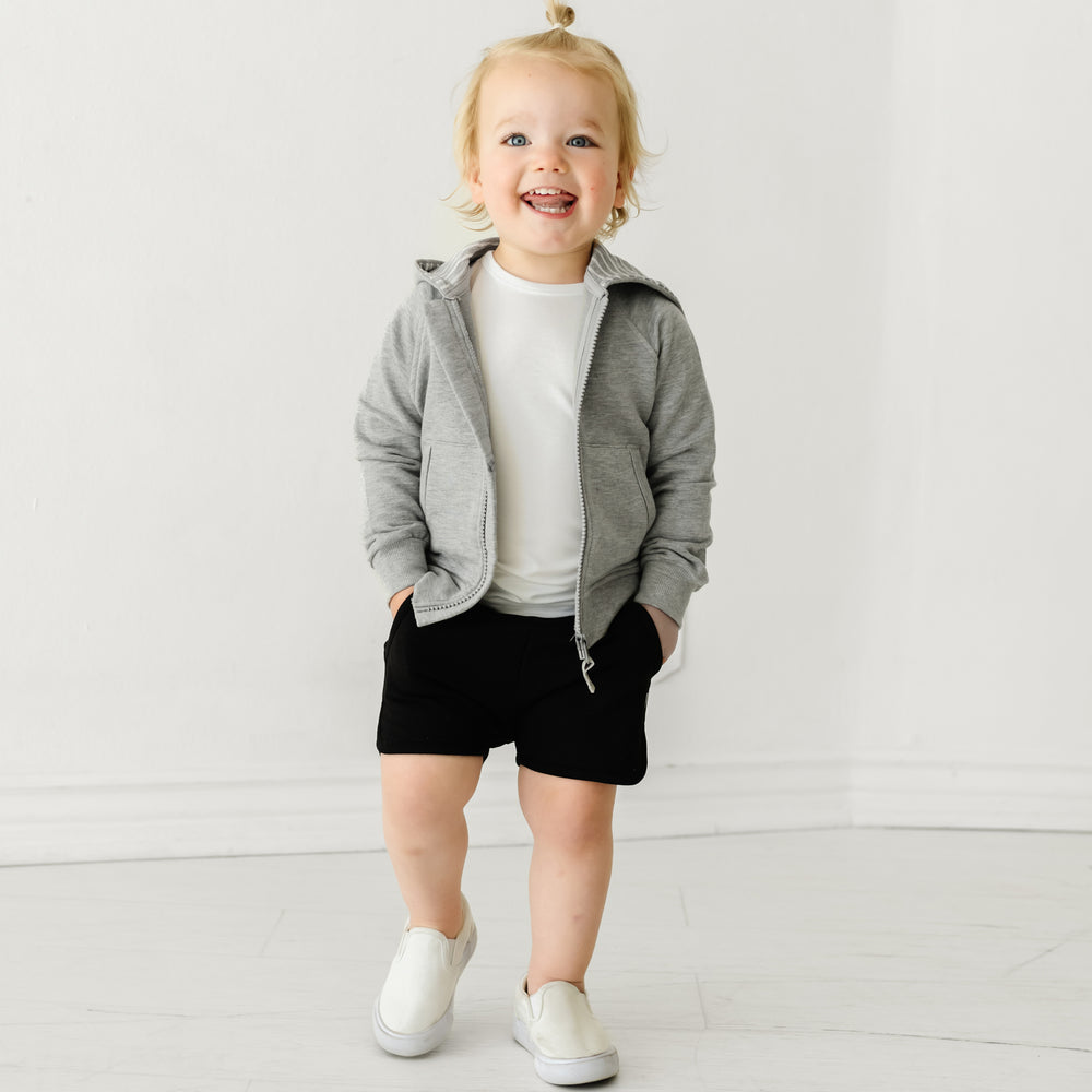 Alternate image of a child wearing Black dolphin shorts and coordinating Play top and zip hoodie