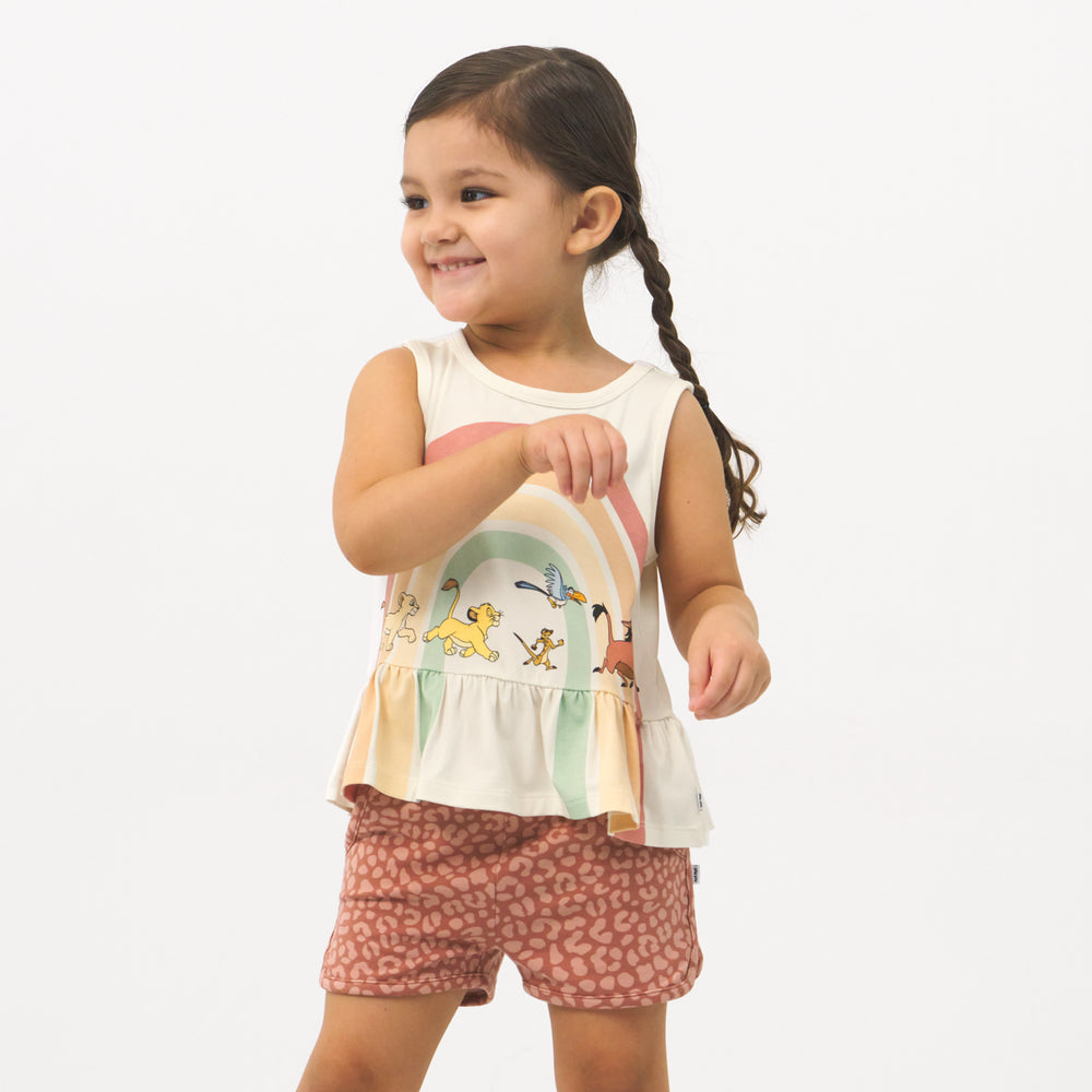 child wearing Desert Leopard dolphin shorts and coordinating Play top