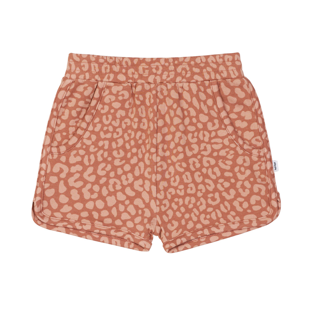 Flat lay image of Desert Leopard dolphin shorts