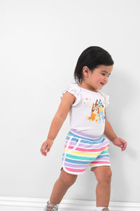 Girl wearing the Rainbow Stripes Dolphin Shorts