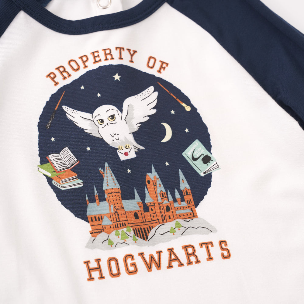 Close up detail shot of a Property of Hogwarts Raglan Bodysuit