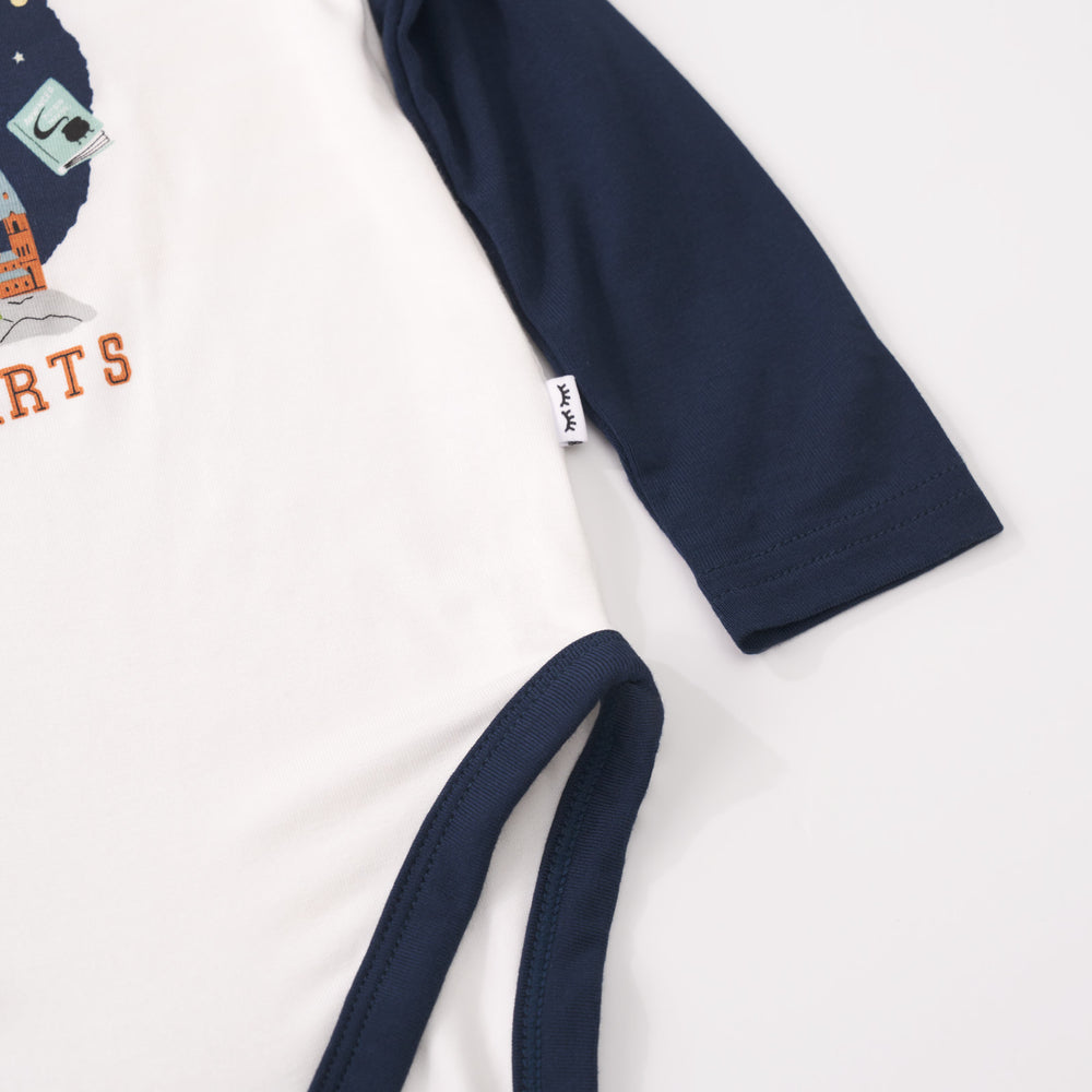 Detail shot of a Property of Hogwarts Raglan Bodysuit