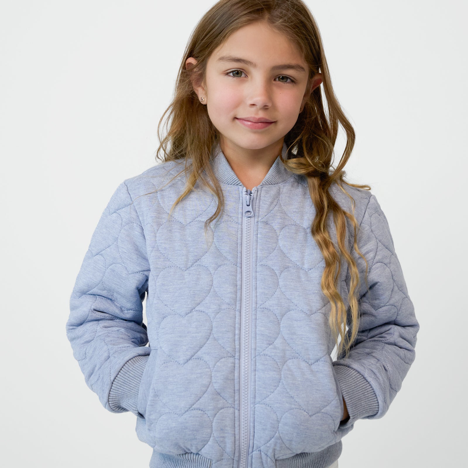 Close up of a child wearing a zipped up Light Blue Denim Quilted Varsity Jacket