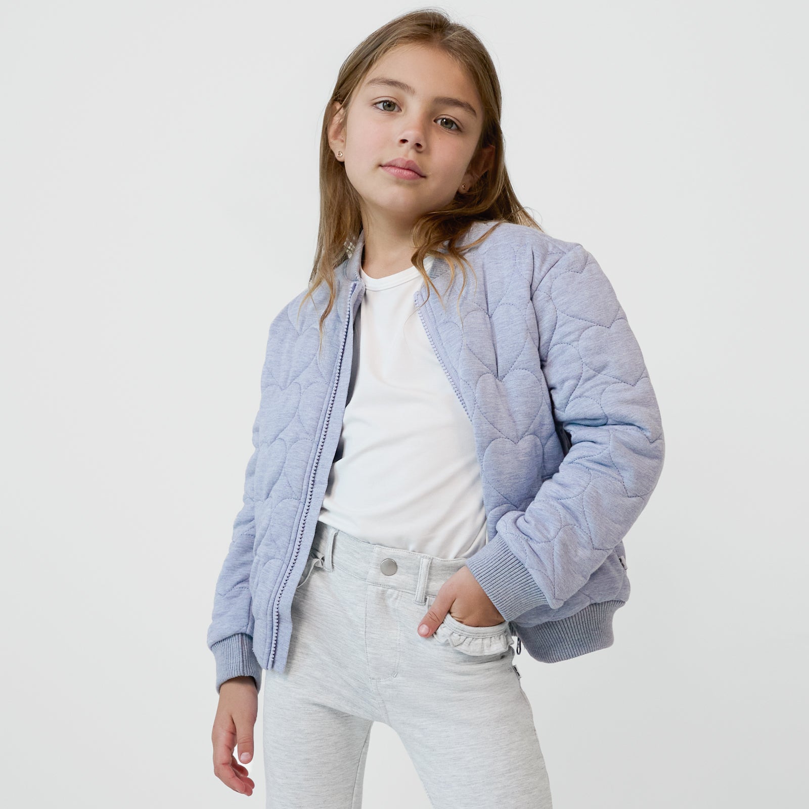 Child wearing a Light Blue Denim Quilted Varsity Jacket layered with a soft white tee and coordinating pants