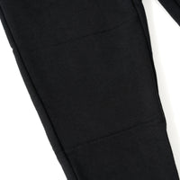 Close up image of the knee detail on the Black Play Jogger
