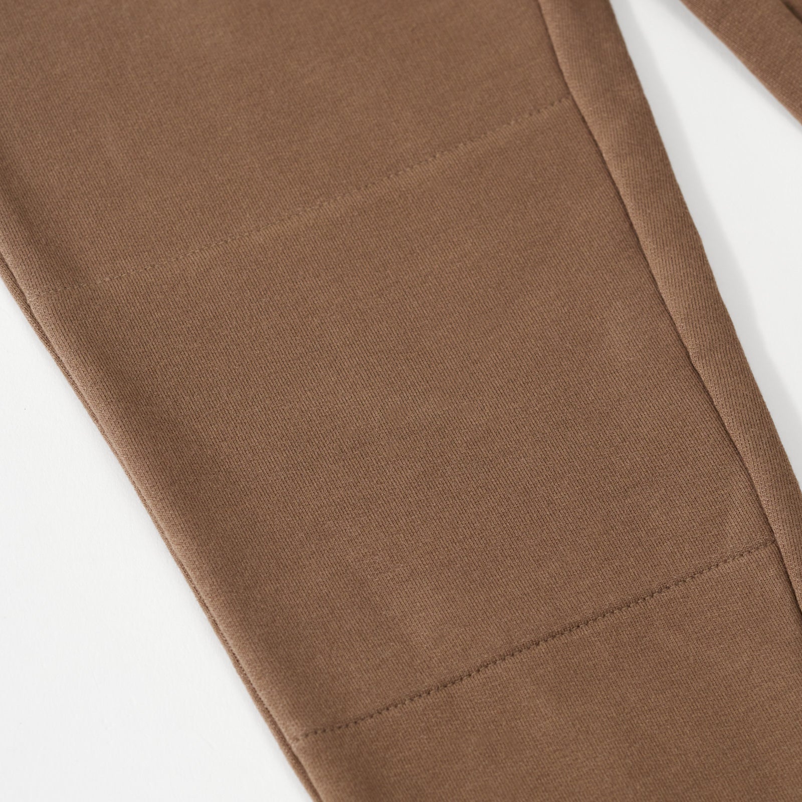 Close up flat lay image of the knee detail on the Vintage Brown Jogger