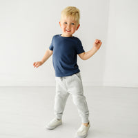 Child wearing Light Heather Gray joggers and coordinating Play top