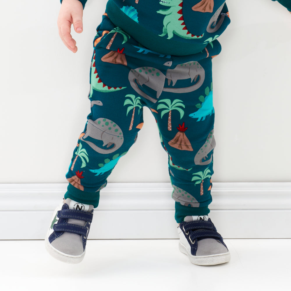 Click to see full screen - Close up image of a child wearing Teal Prehistoric Pals joggers