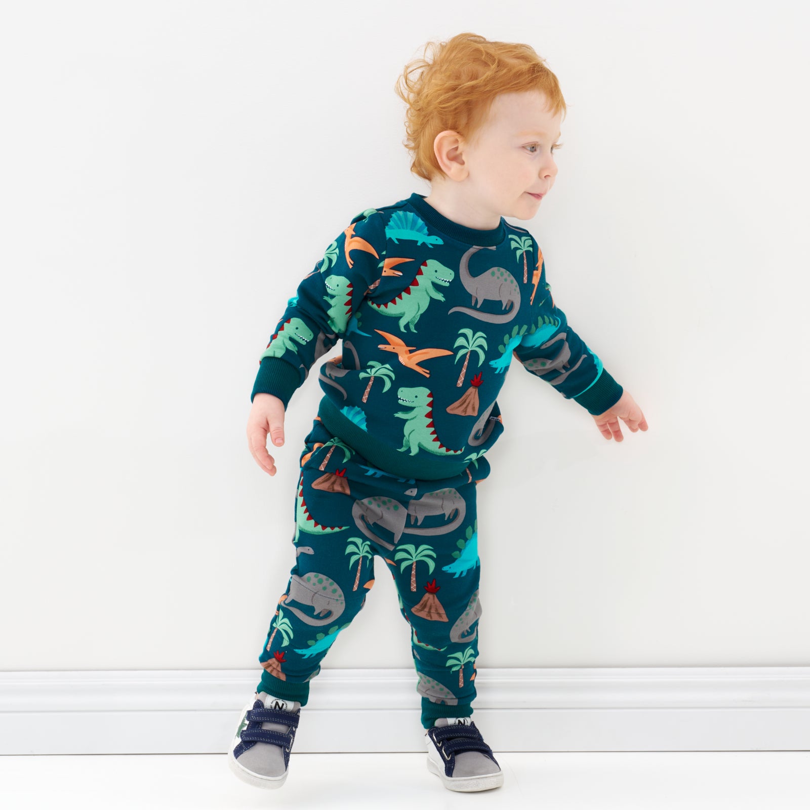 boy in matching dino crewneck and jogger
