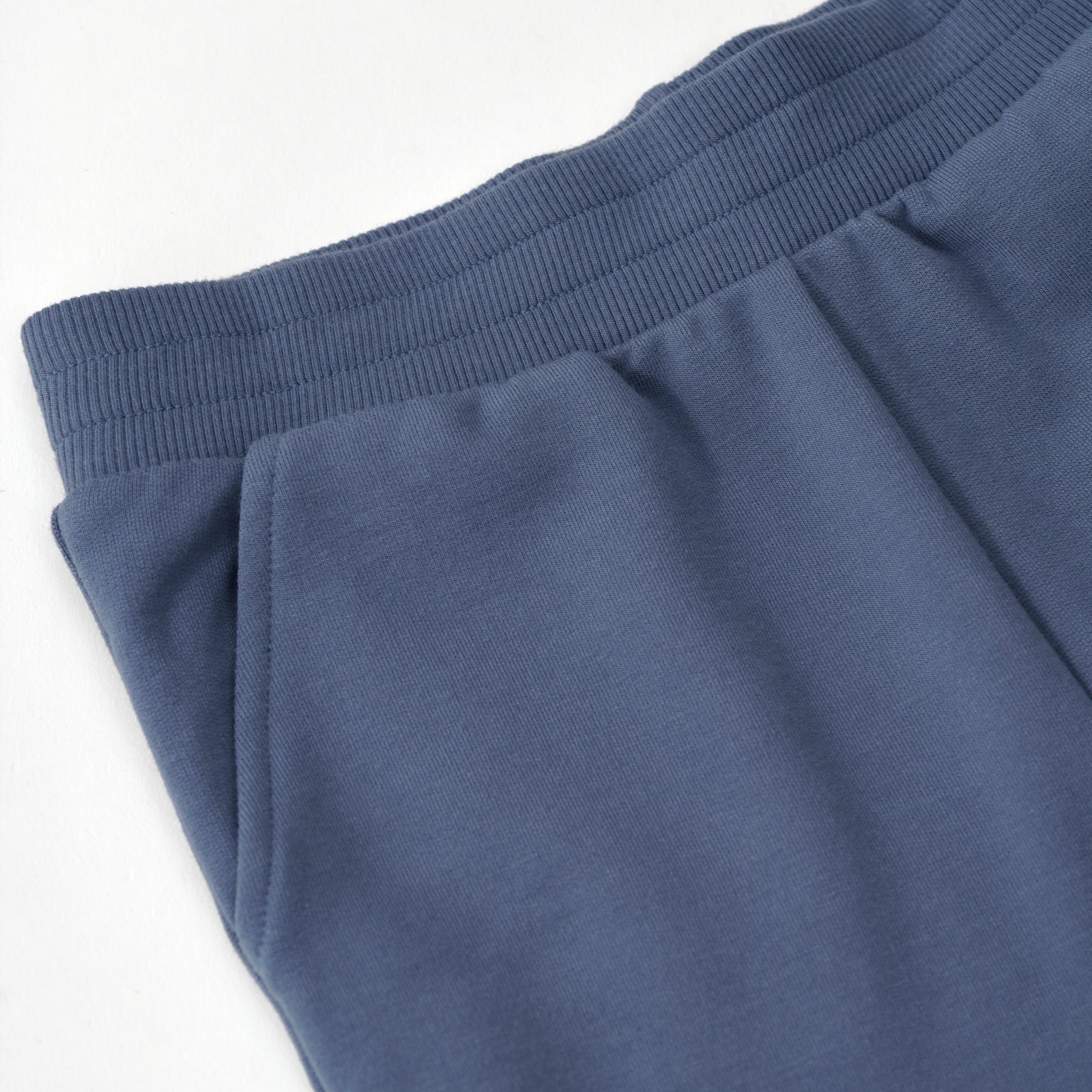 Close up image of the pocket detail on the Vintage Navy Jogger