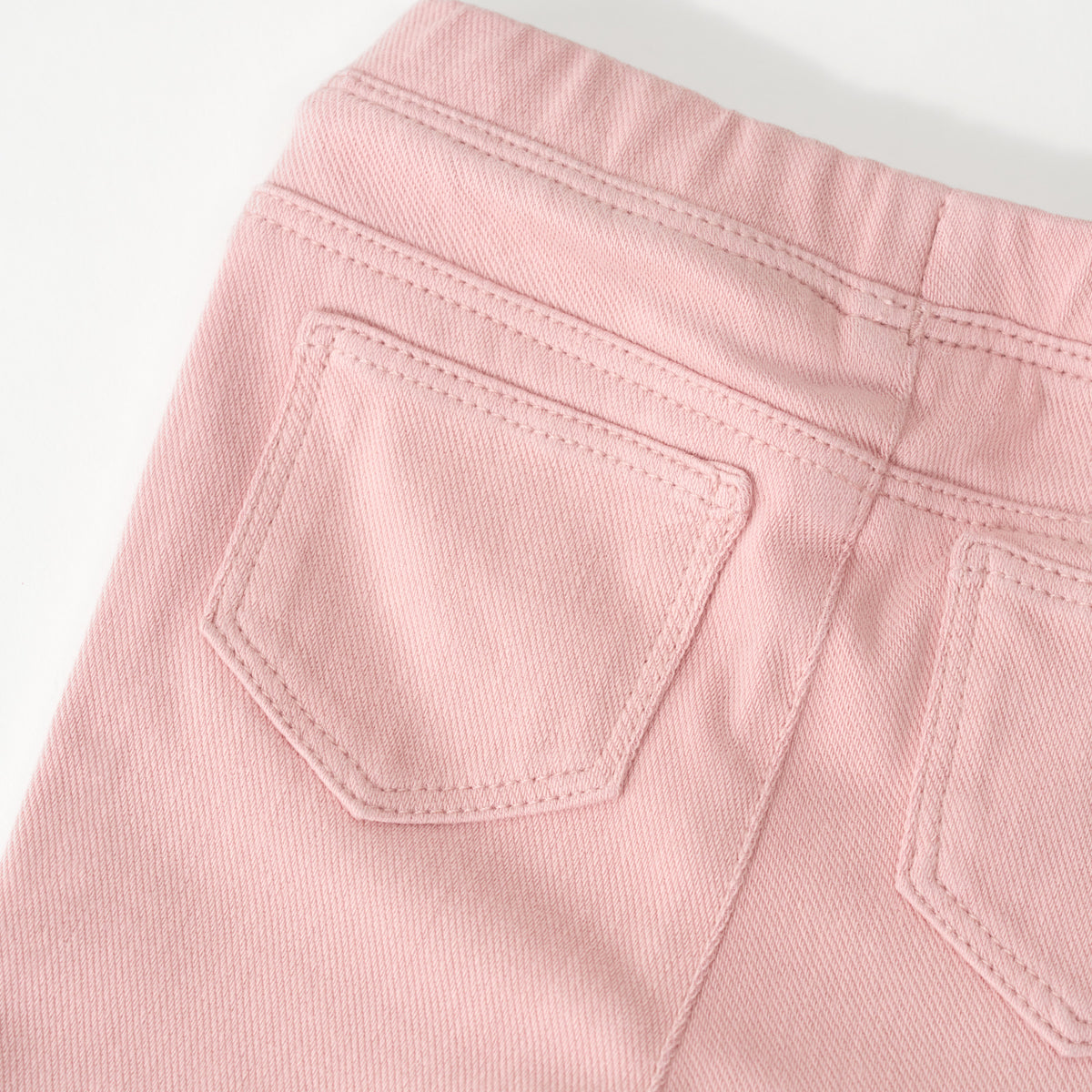 Close up flat lay of the back on the Mauve Blush Denim Jegging