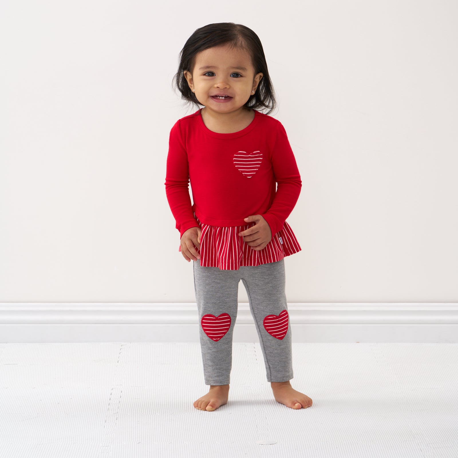 Alternate image of a child wearing Heart Patch leggings and coordinating peplum tee