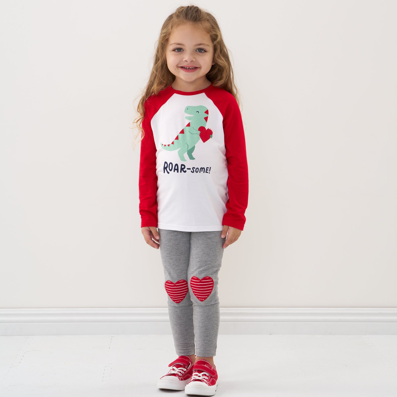 Child wearing Heart Patch leggings and coordinating graphic tee