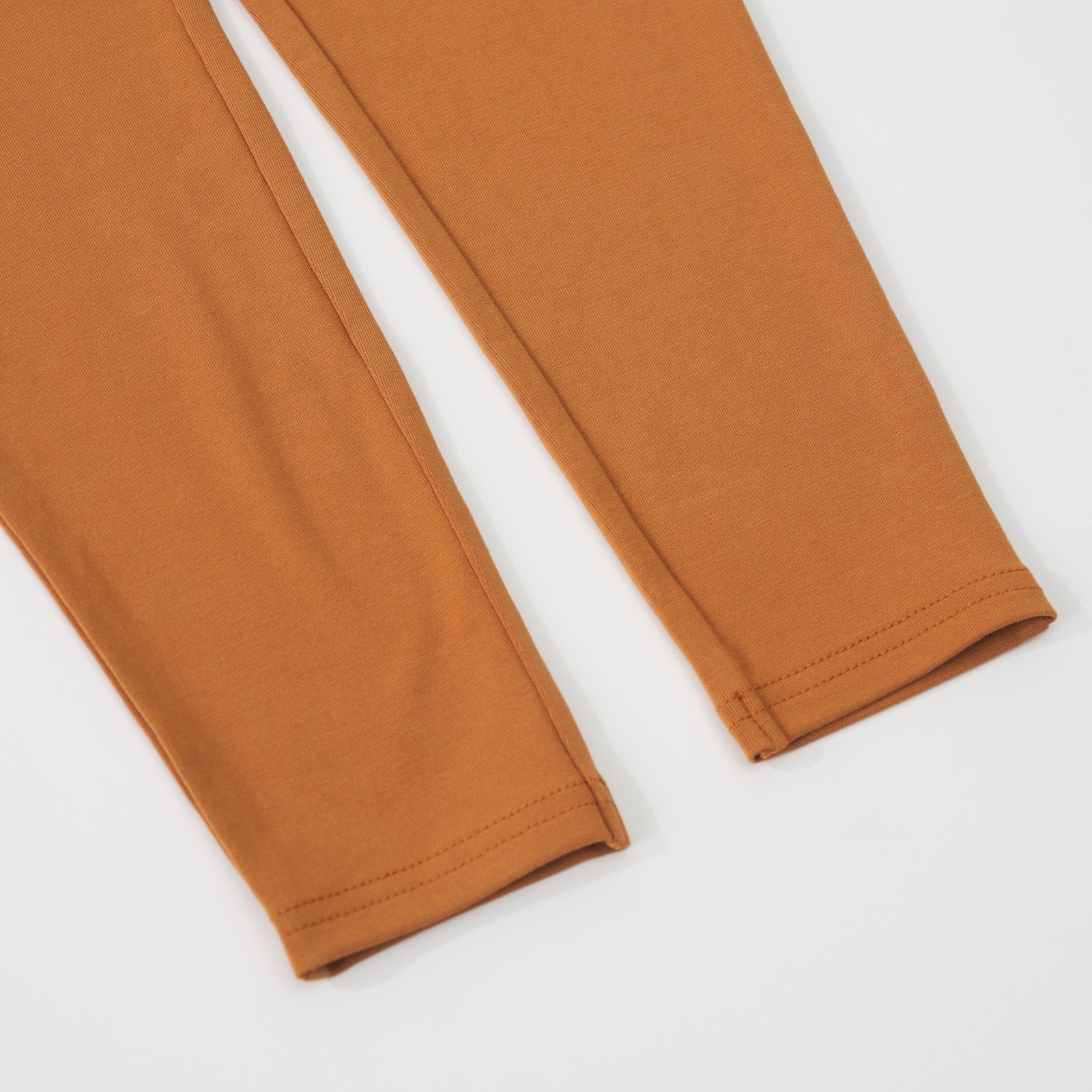 Close-up view of the ankle hems on a Golden Brown girls leggings