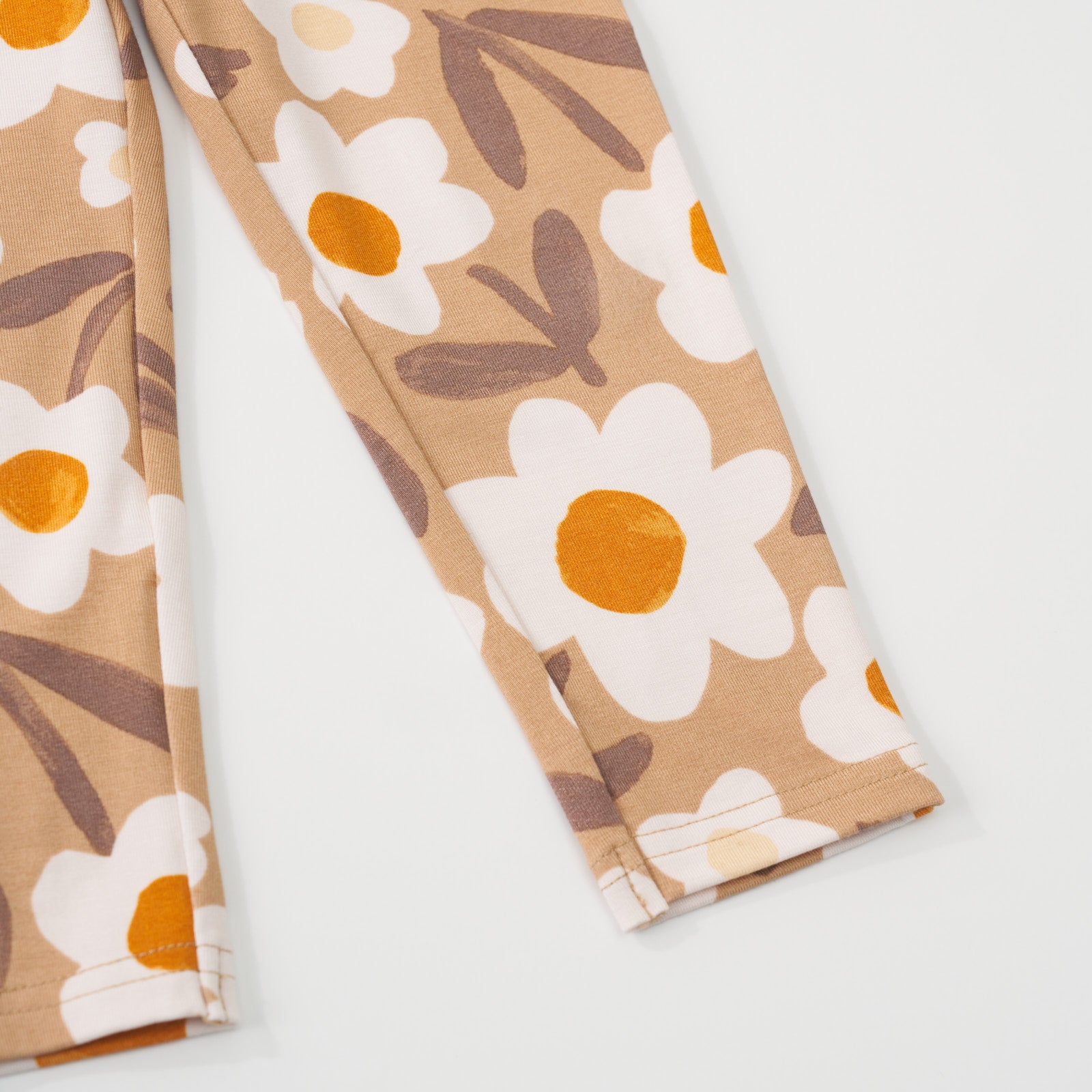 Close-up view of the ankle hem on a Daisy Daydream legging