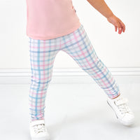 Close up image of a child wearing Playful Plaid leggings and coordinating top