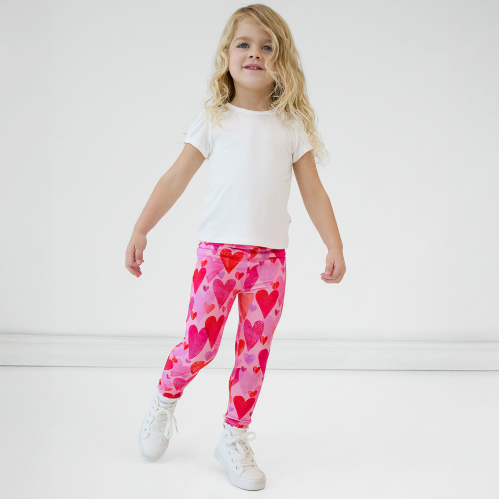 Child wearing a Pink Hearts & Crafts Legging with a coordinating white top