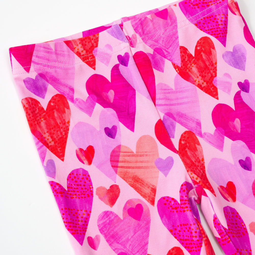 close up flat lay of a pink hearts & crafts legging