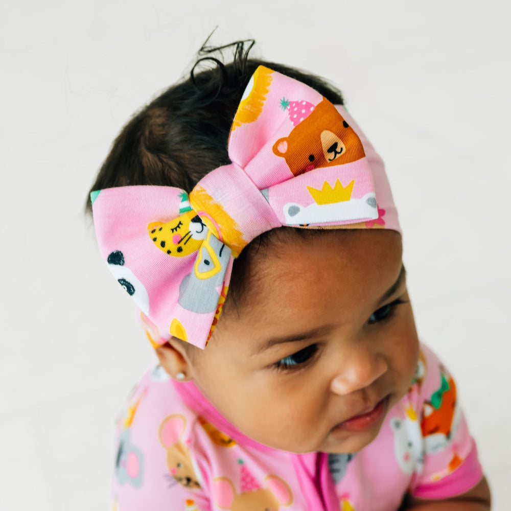 Girl wearing Pink Party Pals Luxe Bow Headband