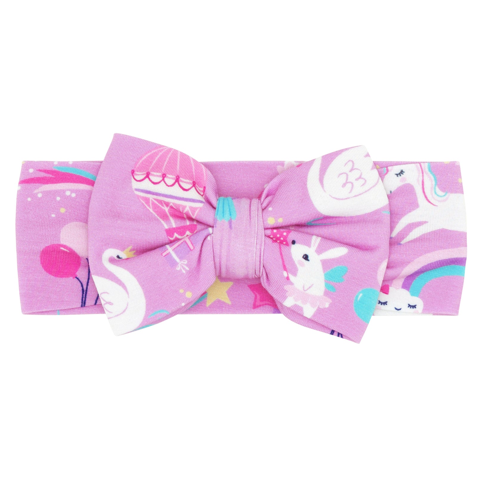 Flat lay image of a Magical Birthday luxe bow headband