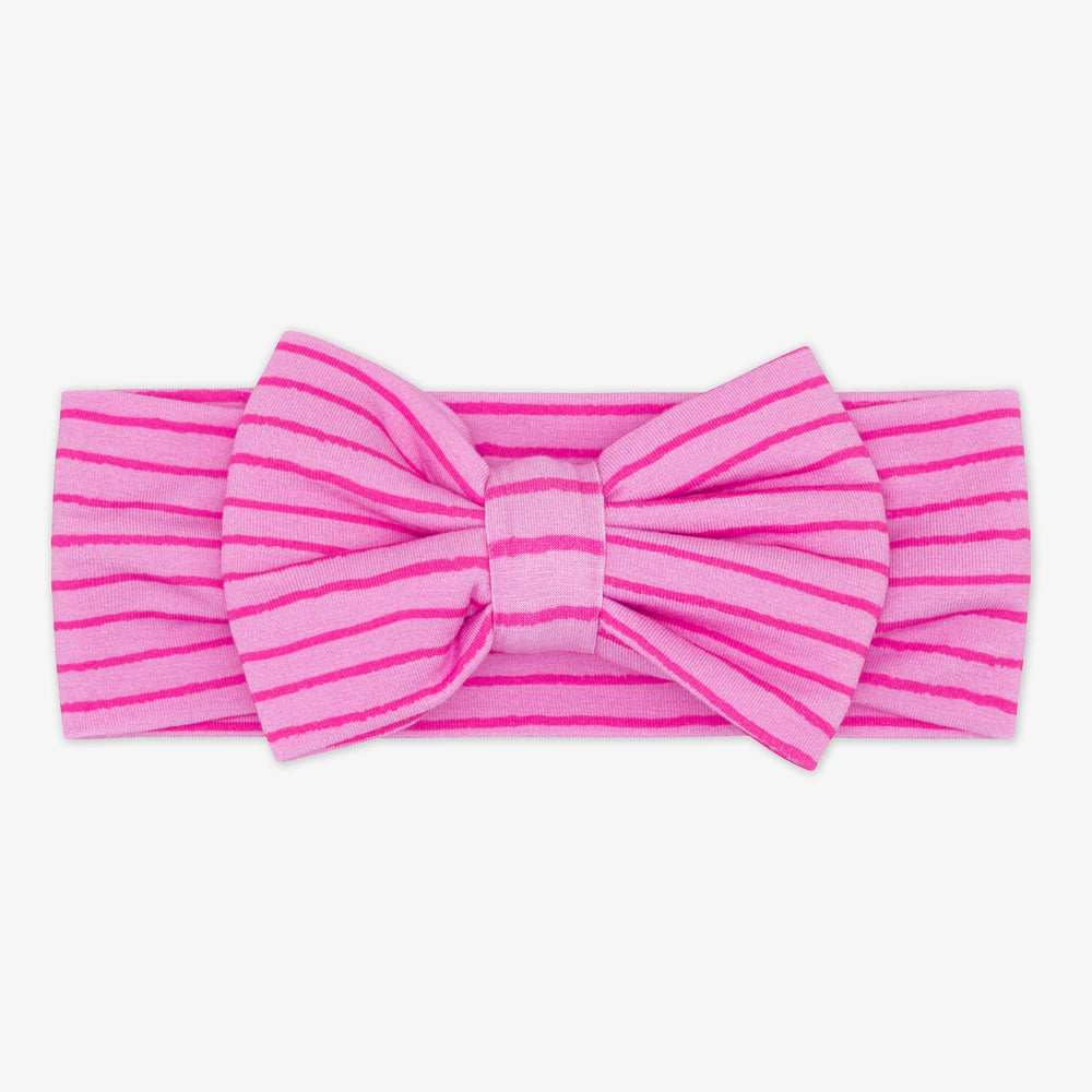 Flat lay image of a Tonal Pink Stripes luxe bow headband