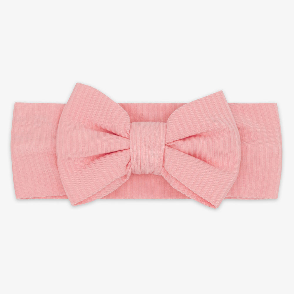 Flat lay image of the Bubblegum Ribbed Luxe Bow Headband