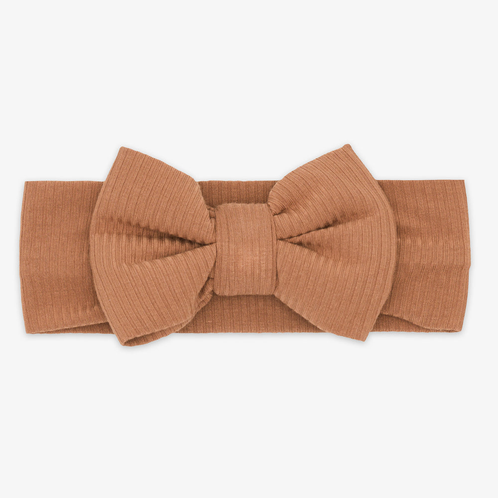 Flat lay image of the Caramel Ribbed Luxe Bow Headband