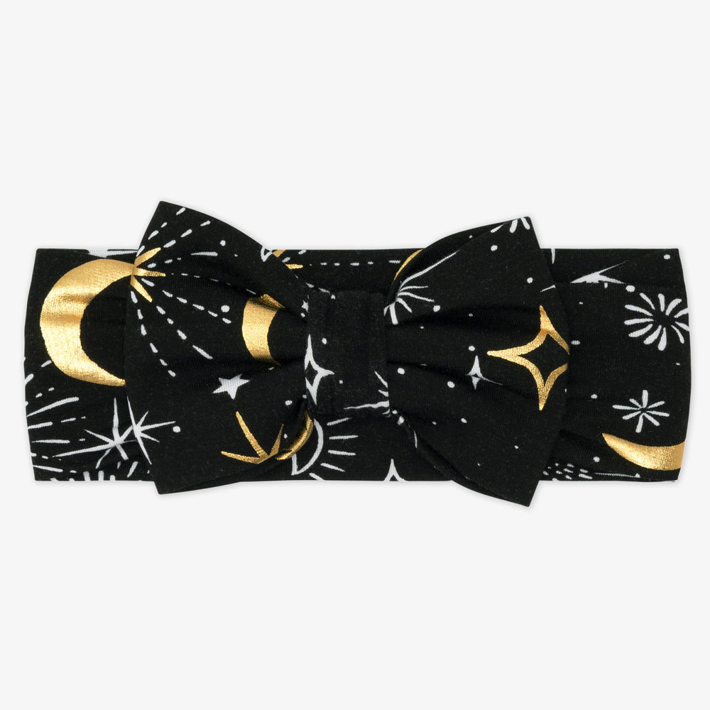 Flat lay image of a Celebration Stars luxe bow headband