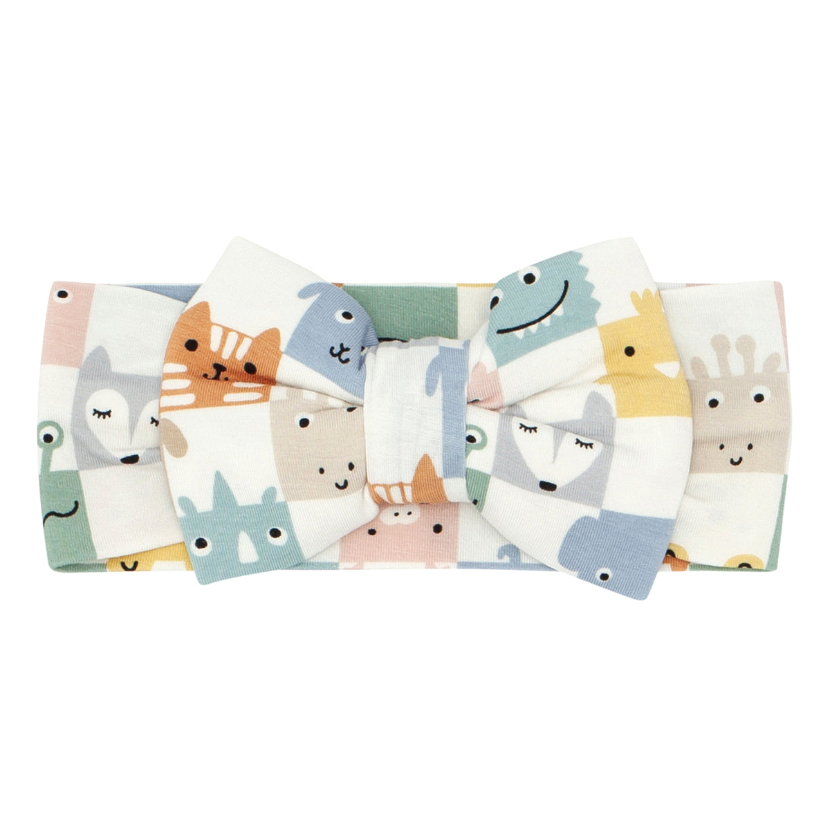 Flat lay image of a Check Mates luxe bow headband
