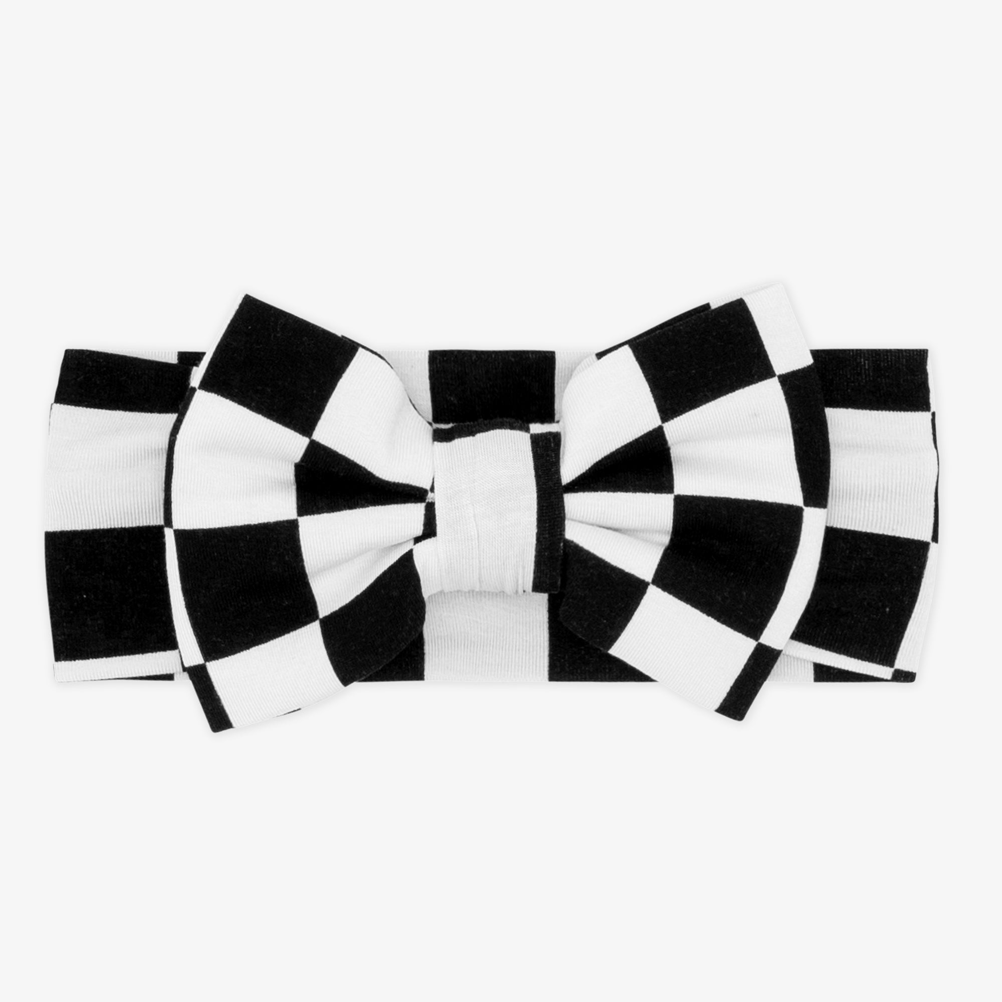 Flat lay image of a Cool Checks luxe bow headband