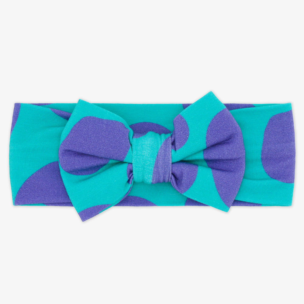 Flat lay image of the Disney Monsters, Inc. Sulley Luxe Bow Headband