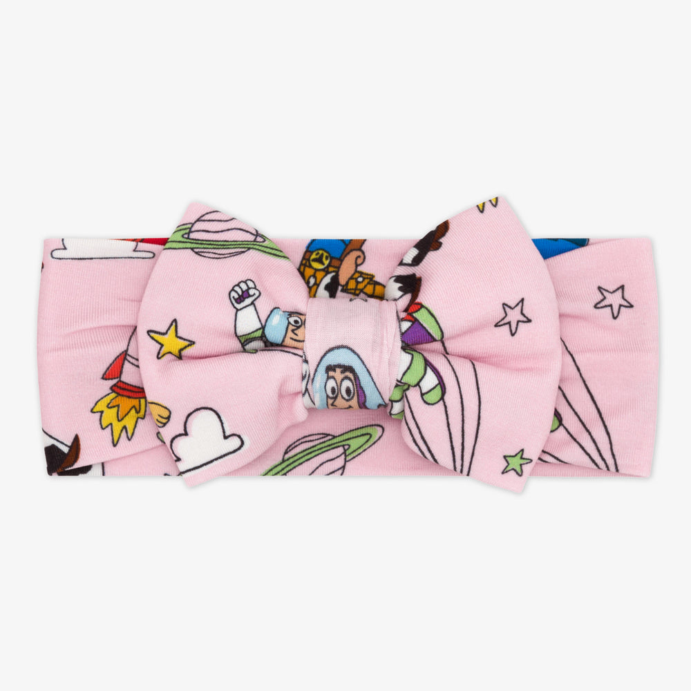 Flat lay image of a Pink Toy Story Stars two piece pj set