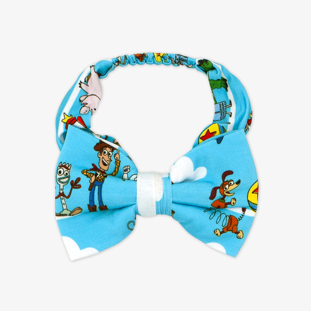 Flat lay image of a Disney Pixar Toy Story Pals luxe bow headband in size 4T to 8 years old