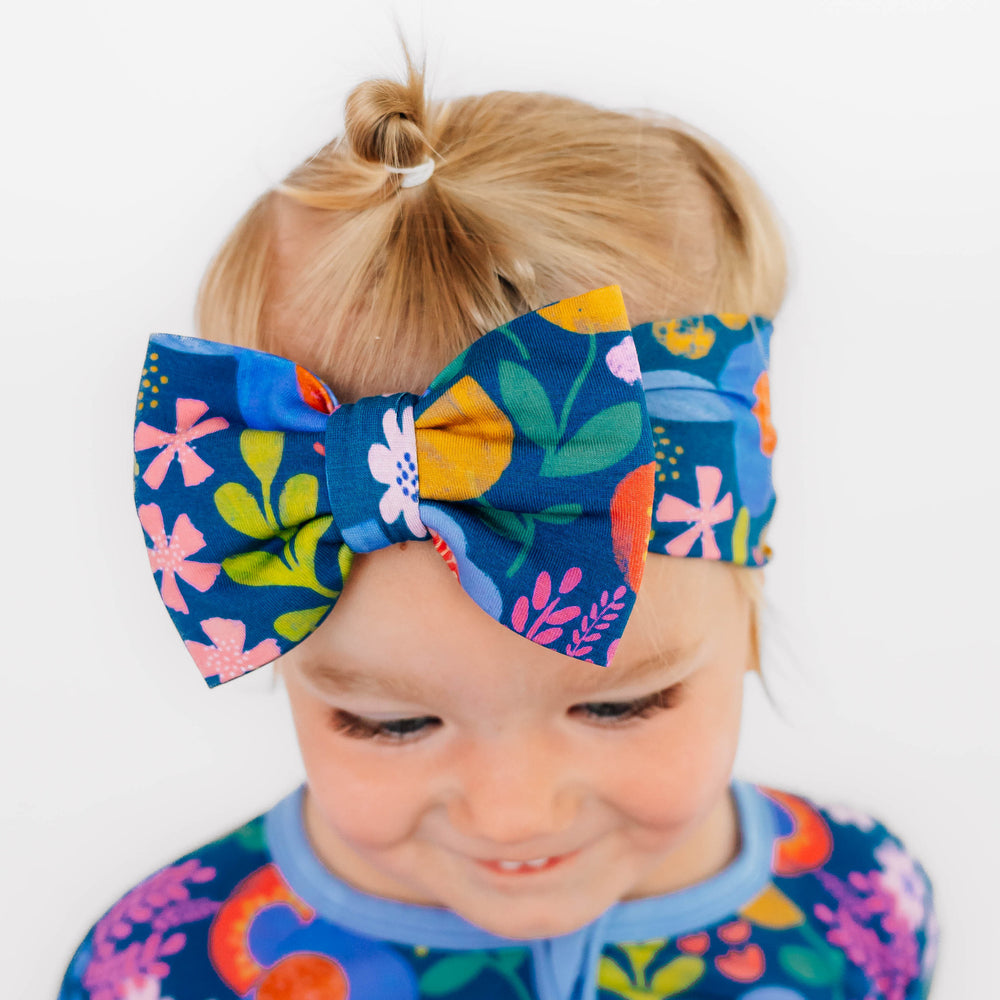 Close up image of girl wearing a Folk Floral Luxe Bow Headband
