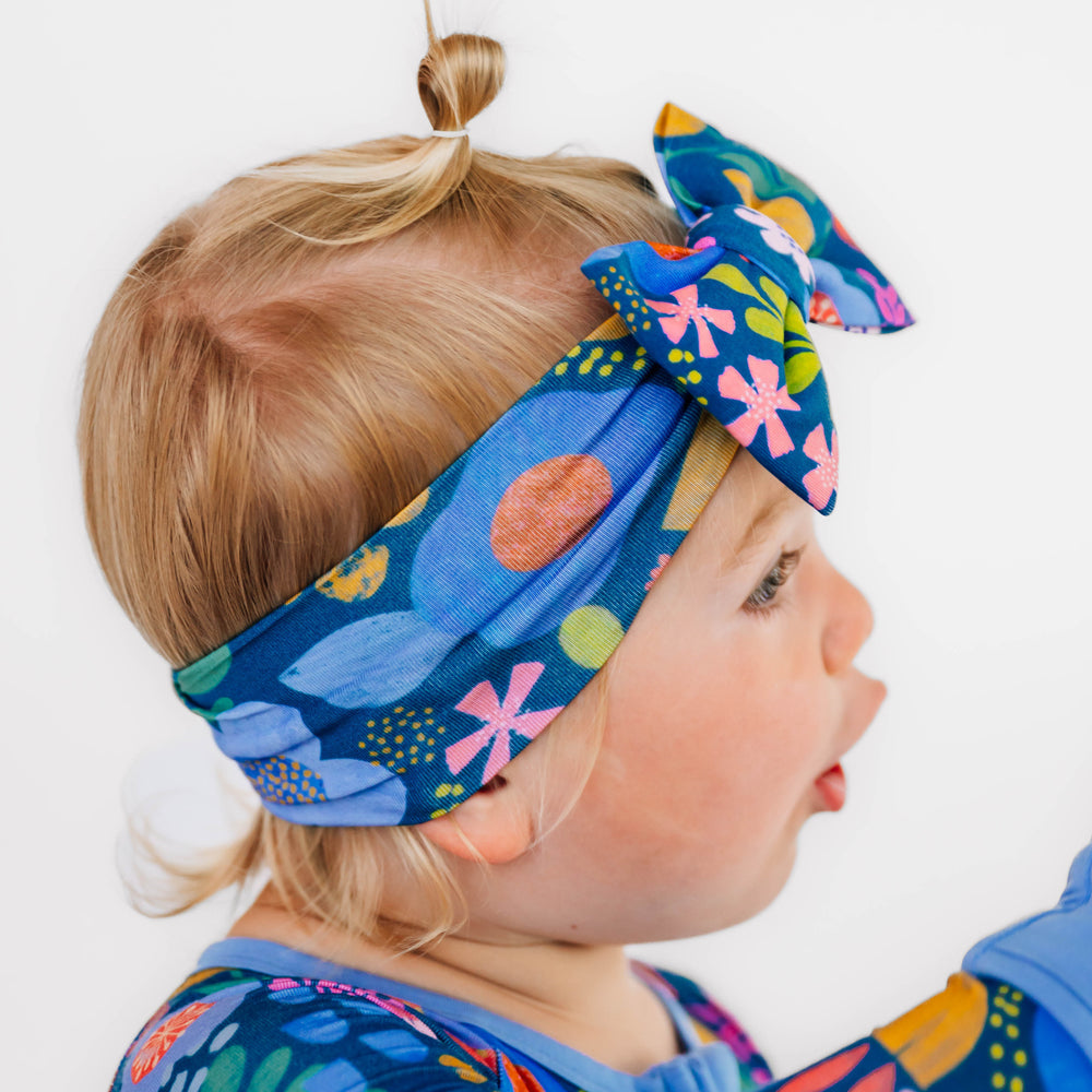 Side view of girl wearing the Folk Floral Luxe Bow Headband